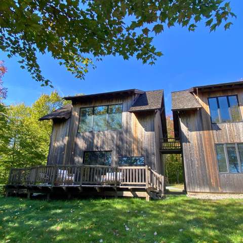 The cabin from outside, deck facing the meadow