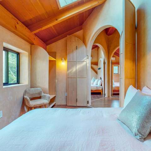 Arched plaster bedroom inside the cabin